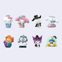 Set of colorful Sanrio figurines with various outfits on a light purple background