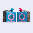 Two keychains in their packaging with 'Kidrobot' branding on a light gray background.