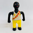 Toy figure with a white tank top featuring red and yellow text and yellow pants on a white background