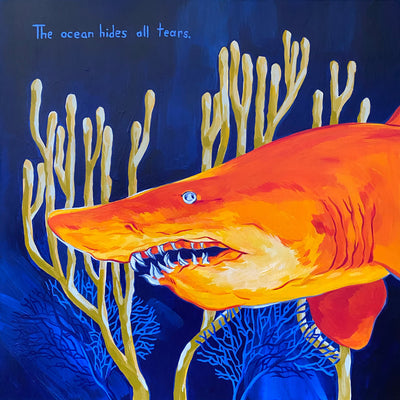 Painting of a realistically rendered bright orange shark, swimming in dark blue water with coral behind it. Text in the upper left reads "The ocean hides all tears."