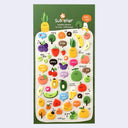 Sheet of colorful stickers with various fruit and vegetable designs on a green background