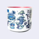 White ceramic mug with a metallic pink interior and various illustrations on it, all within a color scheme of blue, pink, white and green. Illustrations include an exterior of a plant nursery, a bowl of ramen, a stone lantern with a tree behind it, and a taiyaki.