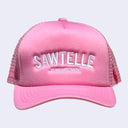 Light pink snapback cap with mesh backing. Text reads "SAWTELLE" in large white sans serif font with "Japantown" written below in smaller, matching font.