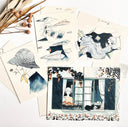 Collection of artistic postcards with various designs on a white background