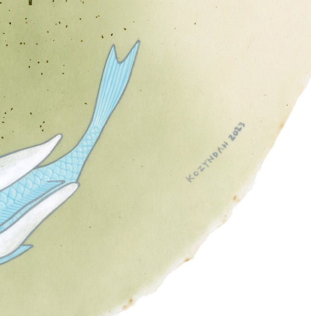 Paper circle with deckled edges and a soft olive green and cream colored watercolor background. Blue and green fish with white bunny heads swim calmly. Close up showing artist signature.