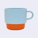 Two-toned mug with light blue top and orange bottom on a white background