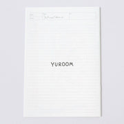 White sheet of paper with 'YUROOM' printed on a light gray background