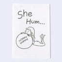 Book cover for "She Hum..." featuring an illustration of a character holding a ball with text.