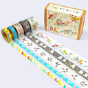 Set of washi tape rolls with decorative designs and a matching box on a white background