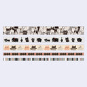 Set of washi tape rolls with cat patterns on a light gray background