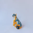 Small ceramic sculpture of an orange and blue-gray fox with carved poppy flower design.