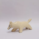 A cream colored ceramic wolf, with an opening in its body that holds gold charms, hanging from wire. Surrounded the opening are ceramic vine shapes.
