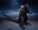 Godzilla action figure posed in a dramatic dark blue and gray studio scene, with textured gray skin, white dorsal spikes, and gold claws.
