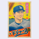 Bright colored risograph print of Shohei Ohtani from the Dodgers, close up showing his face with a slight smile and holding up a bat. Japanese text is in the upper corner and bottom section. Background is a bright yellow sky with the sea.