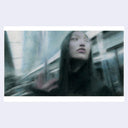 Pastel artwork of a woman with long, dark straight hair on a subway with the subject matter blurred.