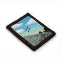 A semi-3D clay artwork, shaped like a card with a blue sky with white clouds, four black birds in flight, and a gray fence in the foreground, set against a plain white background. Scene is kept within a clay frame made to look like wood.