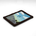 A semi-3D clay artwork, shaped like a card with a blue sky with white clouds, four black birds in flight, and a gray fence in the foreground, set against a plain white background. Scene is kept within a clay frame made to look like wood.
