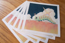 Set of illustrated art prints with a caterpillar on a wooden surface