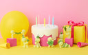 Birthday cake with candles, gift box, and small figurines on a pink and yellow background