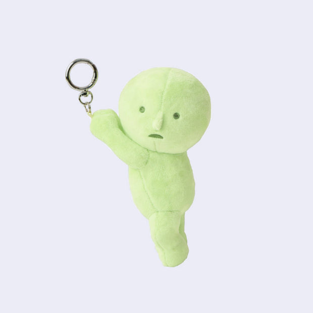 Plush keychain of a Smiski, dangling from a keyring.