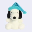 Plush doll of Snoopy, with a blue fuzzy sleeping cap.