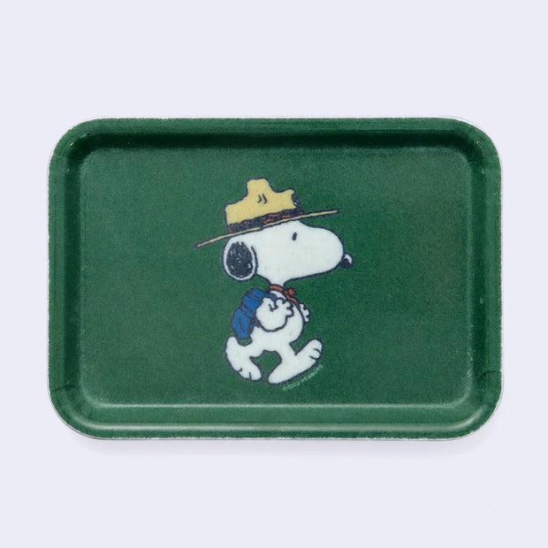 Forest green rectangular tray with rounded edges and a graphic of Snoopy dressed as a Beagle Scout, walking with a backpack.