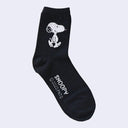 Black crew socks with a fluffy detail of Snoopy, smiling and walking, on the side of the calf part of the sock.