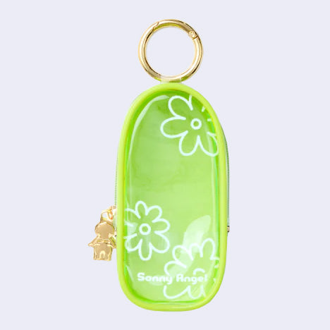 Green clear colored oval shaped pouch attached to a keychain, with gold keychain hardware and a small golden Sonny Angel on the side. White line doodles decorate the exterior.