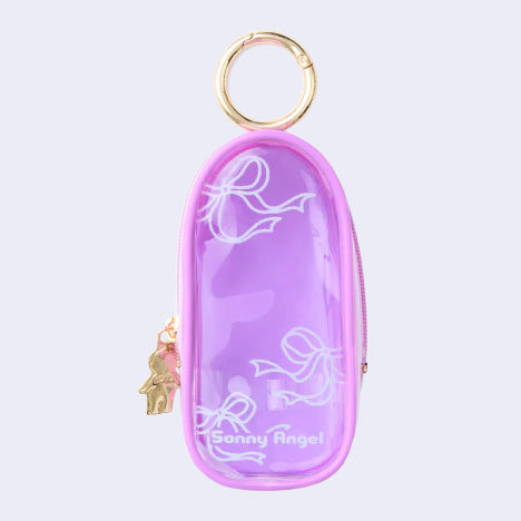 Purple clear colored oval shaped pouch attached to a keychain, with gold keychain hardware and a small golden Sonny Angel on the side. White line doodles decorate the exterior.