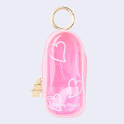 Pink clear colored oval shaped pouch attached to a keychain, with gold keychain hardware and a small golden Sonny Angel on the side. White line doodles decorate the exterior.