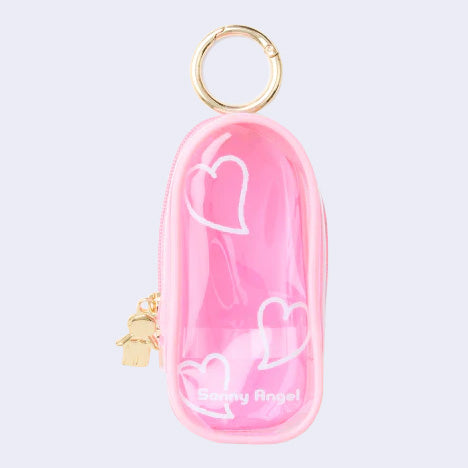 Pink clear colored oval shaped pouch attached to a keychain, with gold keychain hardware and a small golden Sonny Angel on the side. White line doodles decorate the exterior.