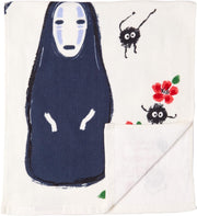 Cream colored tea towel with image of No Face from Spirited Away below a pine bonsai tree.