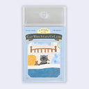 A package of 'A Story of the Cat Who Stays Up Late' sticky notes, featuring a cute illustration of a black cat in a blue cap on a bed. The notes are in a clear plastic sleeve with a hanging tab, set against a light gray background.