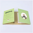 A booklet of sticky notes, light green with Japanese text on one side and an illustration of a fox in a suit on the other, set against a plain light background.