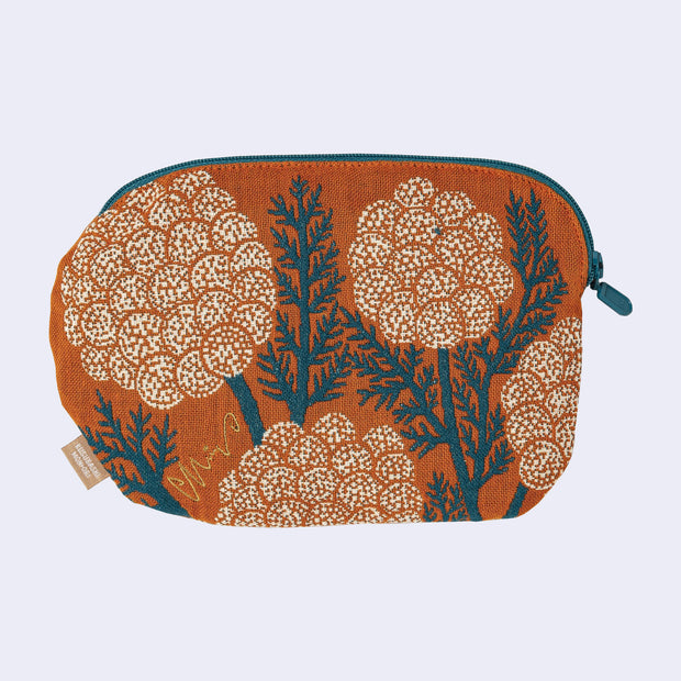 Fabric pouch with tree design on an orange background