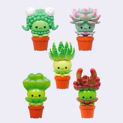 5 different plastic figures shaped as succulents in orange plastic pots. Succulents vary in species and all have cute kawaii style smiling faces.