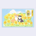 3D pop up card of 2 shiba inu dogs sitting amongst sun flowers in front of a blue sky with fluffy white clouds.