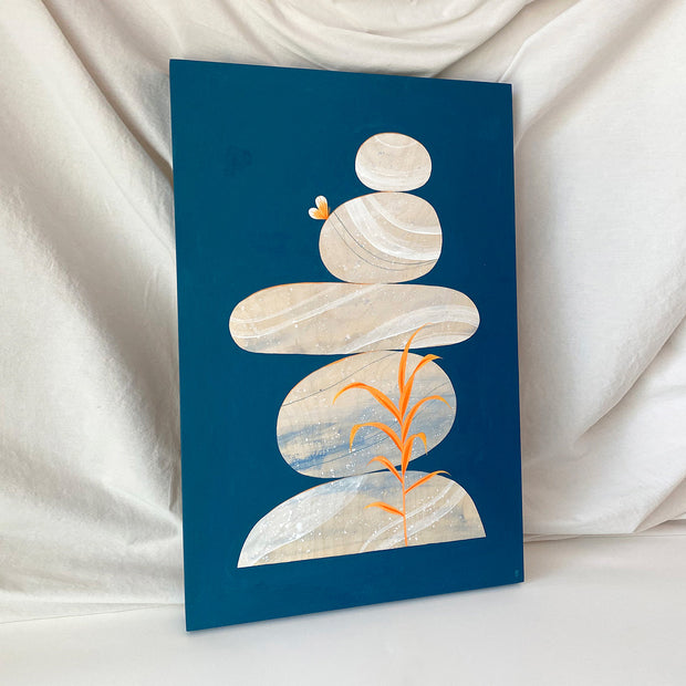 Collage style painting of a balanced stack of rocks on a solid navy blue background. Rocks are cream color with bold abstract marbling patterns, each rock is a different shape or size. A small orange butterfly rests atop a rock and an orange weed grows in front of the stack. Displayed at an angle.