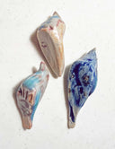 3 ceramic birds lined up.