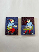 2 paintings of birds playing instruments.