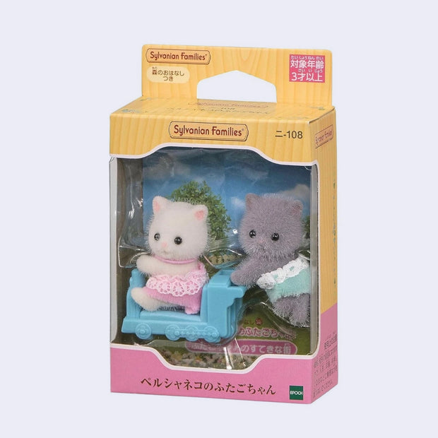 Sylvanian Families cat figures in a car with packaging on a white background