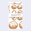 White rectangular tea towel with different breads on it.