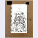 A hand-drawn black ink illustration on a white sheet of paper, taped to a brown kraft paper background. The drawing shows a surreal figure, a girl's head with a large bird head atop of her own. Atop the bird is a mechanical cage-like item that comes down the girl's face as well.