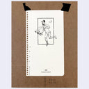 A white spiral-bound notebook page with a black line drawing of a running man, naked aside from underwear and a hat and the text 'TRAVELER'S COMPANY' near the bottom, taped onto a brown kraft paper background with black tape.