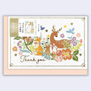 Greeting card and envelope with a pretty illustration of several forest animals sitting amongst florals.