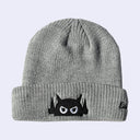 Gray beanie with a black and white face Big Boss Robot design on a light gray background