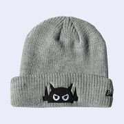 Gray beanie with a black and white face Big Boss Robot design on a light gray background