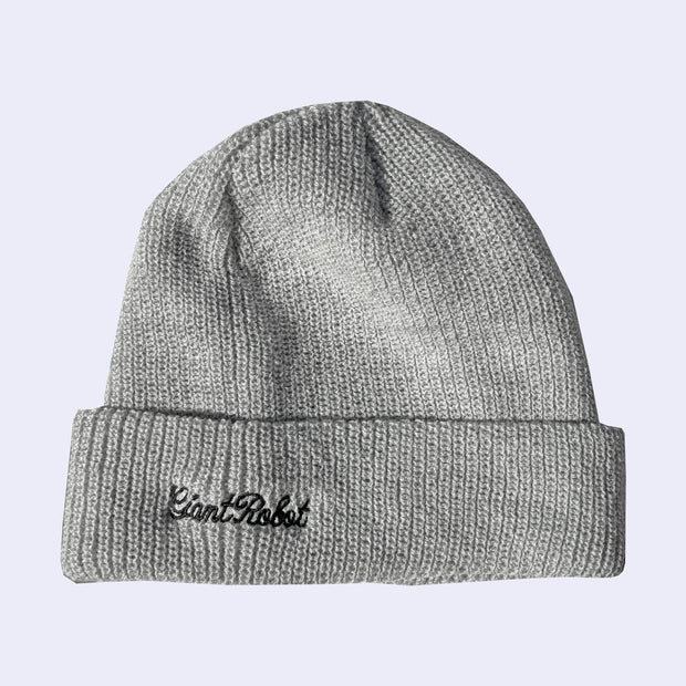 Gray knit beanie with "giant robot" embroidered in cursive on the side.