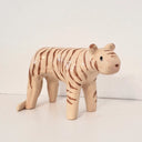 Ceramic sculpture of a light tan colored tiger with brown striping and an oval shaped face.