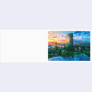Cityscape with modern buildings and a sunset sky